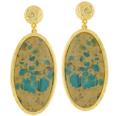 Elegant oval blue turquoise earrings in sterling silver with gold accents, perfect for adding sophistication to any outfit.